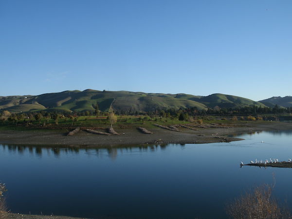 Photograph of - The Niles Hills make a backdrop to Quarry Lakes at dusk.